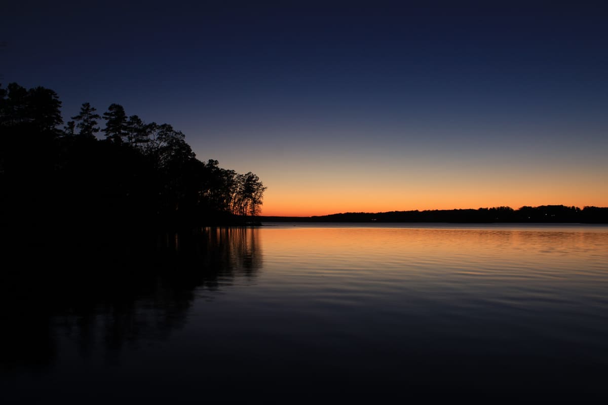 Sunset glowing over the still waters of Badin Lake in the Uwharrie National Forest